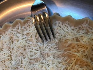 IMG_5341 Add cheese to the pie crust for the Tomato, Bacon & Pesto Tart